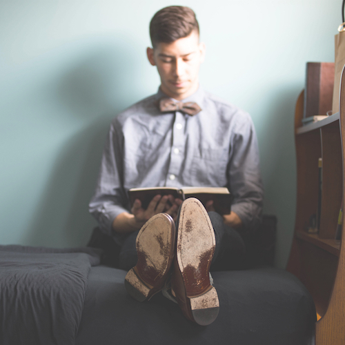 Boy Studying on his Bed