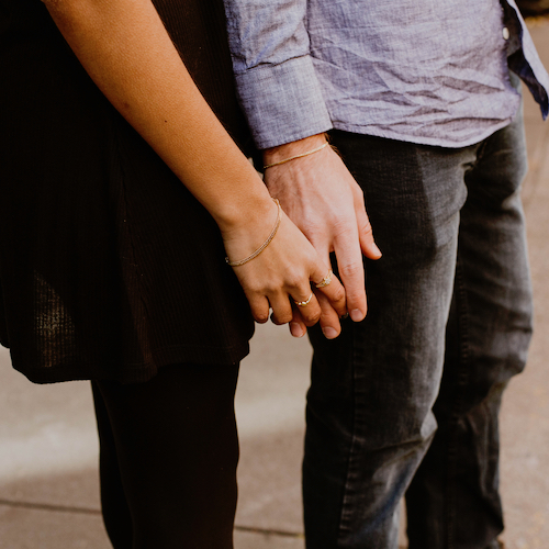 Couple holding hands