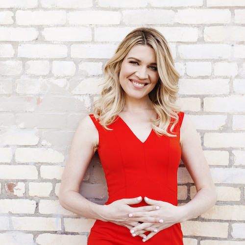Sarah Jones, founder of Introverted Alpha, in a red dress