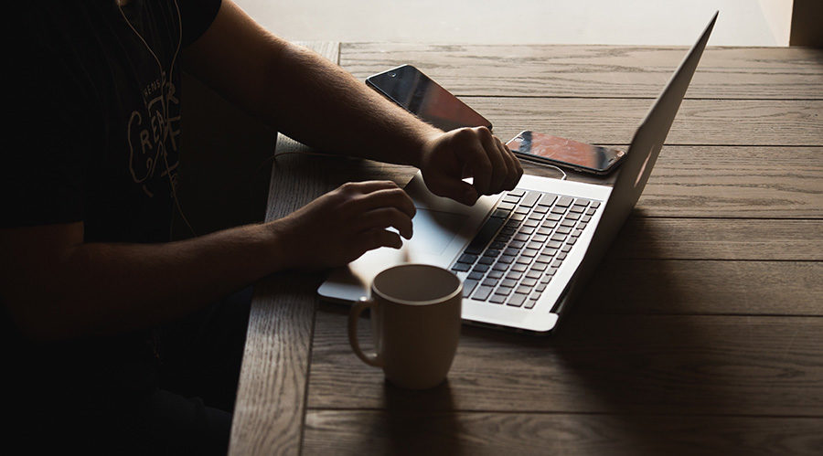 Man Working on Laptop - Online Dating