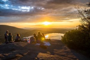 Friends on Mountain at Sunset - Dating Relationship Standards Introverted Alpha