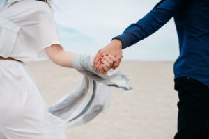 Man and Woman Holding Hands - Dating Relationship Standards Introverted Alpha
