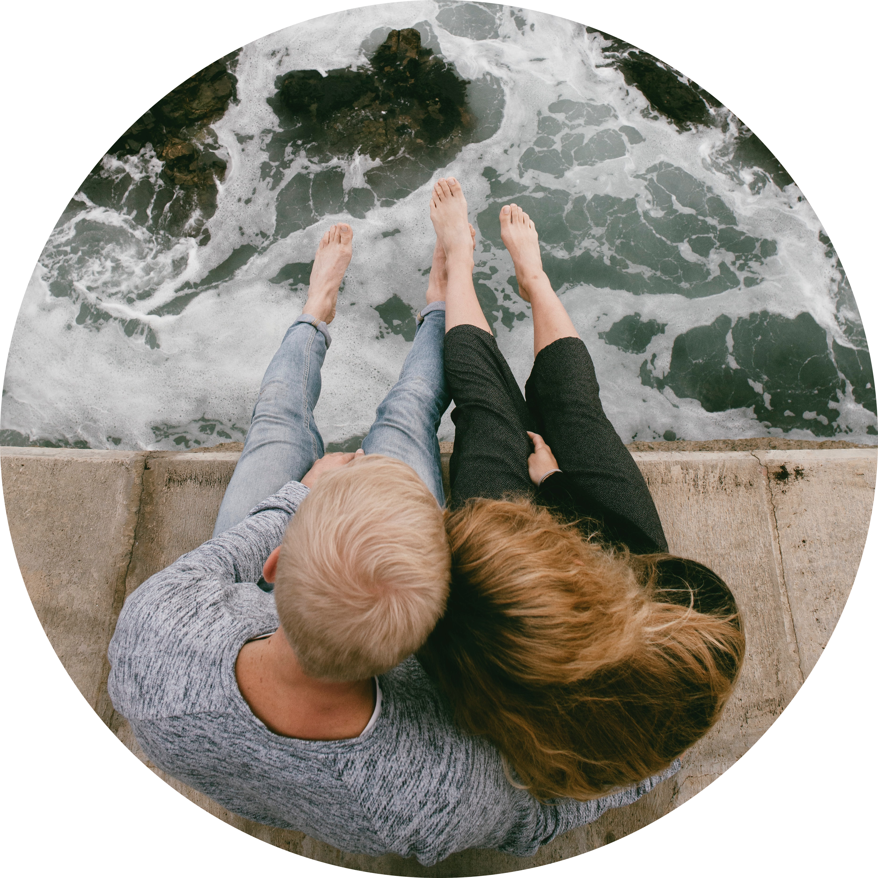 Couple holding hands on beach - circle