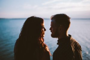 Woman and Man Looking at Each Other - Eye Contact If Flirting