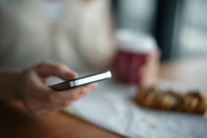 Man Holding Phone - Online Dating Messages That Work