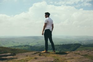 Man Standing on Mountain - Alpha Male Characteristics