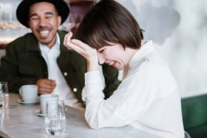couple laughing on a date - first date conversation