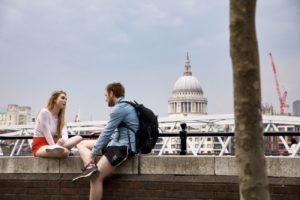 Woman And Man Talking At Pier - Good Conversation Starters