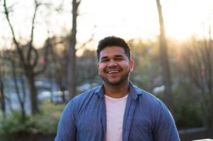 man smiling in woods - how to be more playful as an introvert