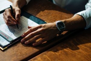 Man Writing In Notebook - INTJ Confidence