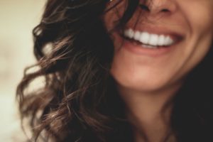 Woman Smiling - How To Tell If Someone Is Flirting With You
