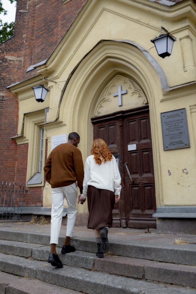 couple walking into church - Christians in Love