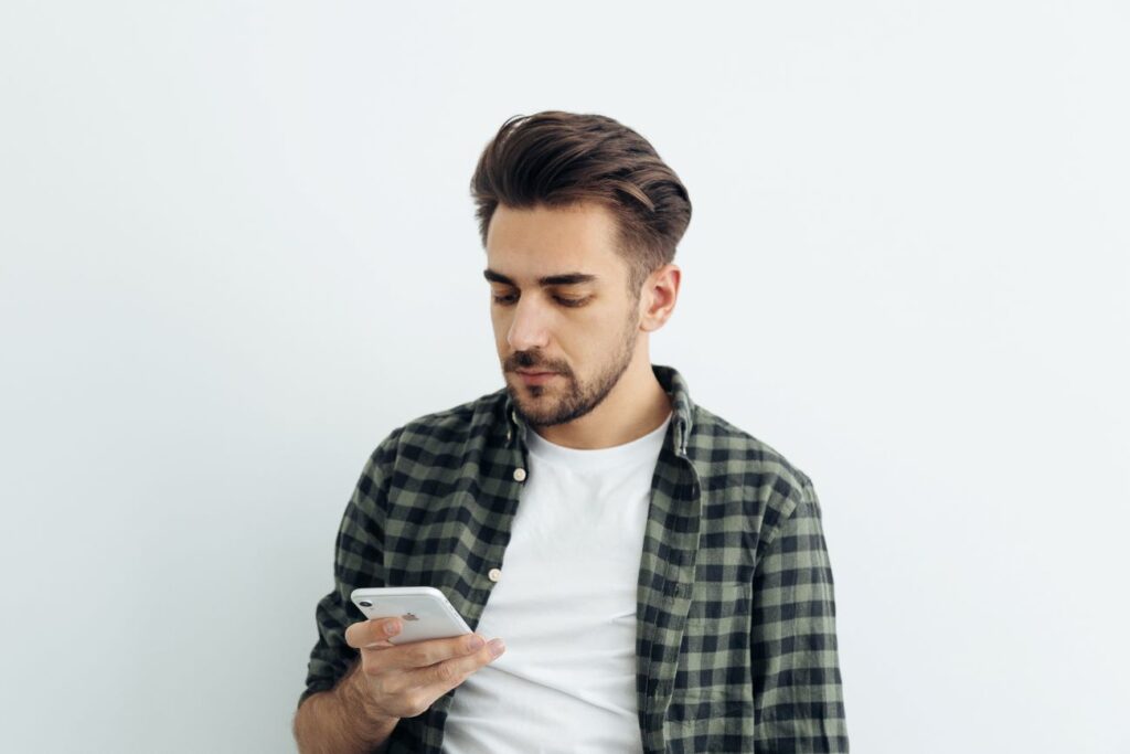 Man Holding Phone - Online Dating For Introverts